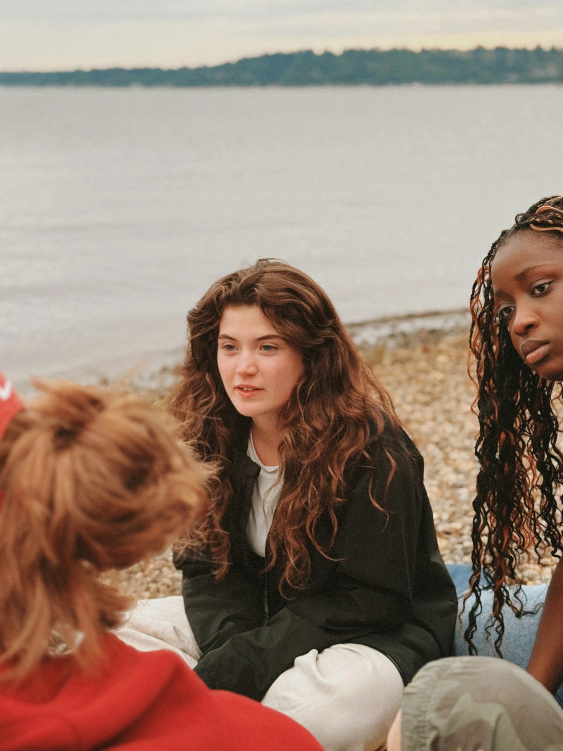Teenagers sitting together in a thoughtful conversation